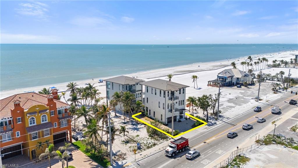 Bird's eye view of waterfront with a beach Virtually Enhanced