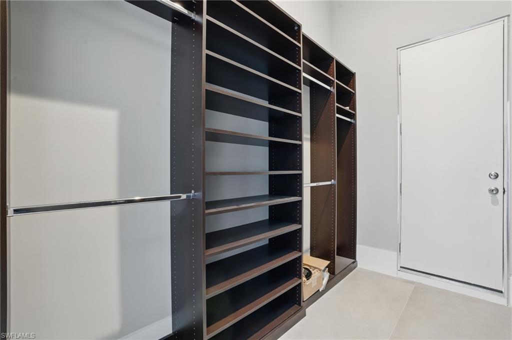 View of walk in closet Virtually Enhanced
