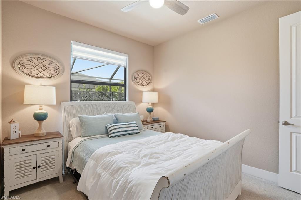 Bedroom with light carpet and ceiling fan