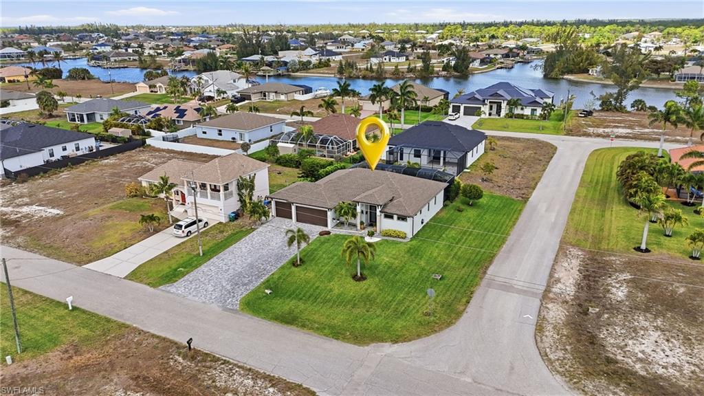 Aerial view of residential area with a large body of water