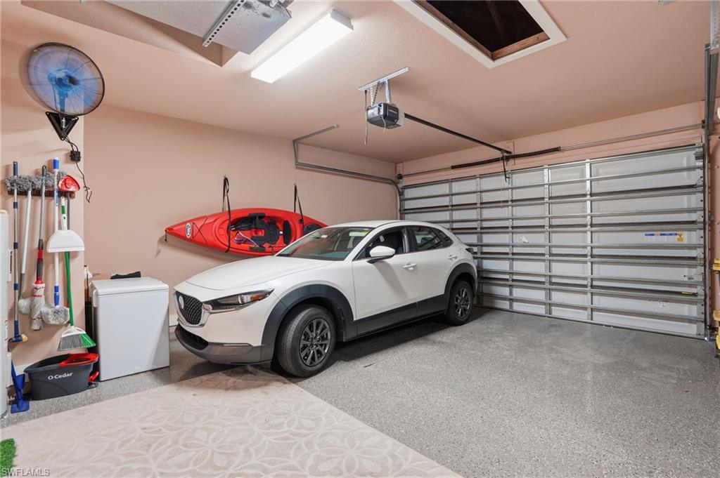 Garage featuring a garage door opener