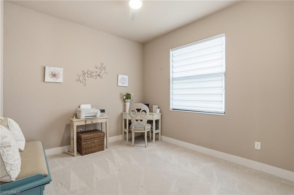 bedroom with carpet floors and baseboards