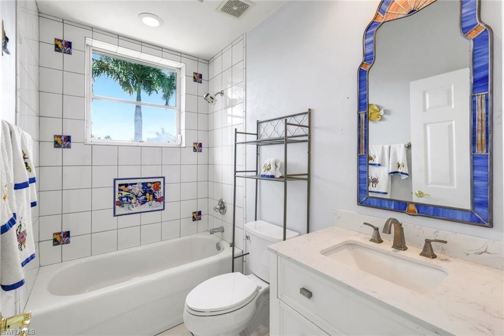 Full bathroom featuring vanity and shower / tub combo