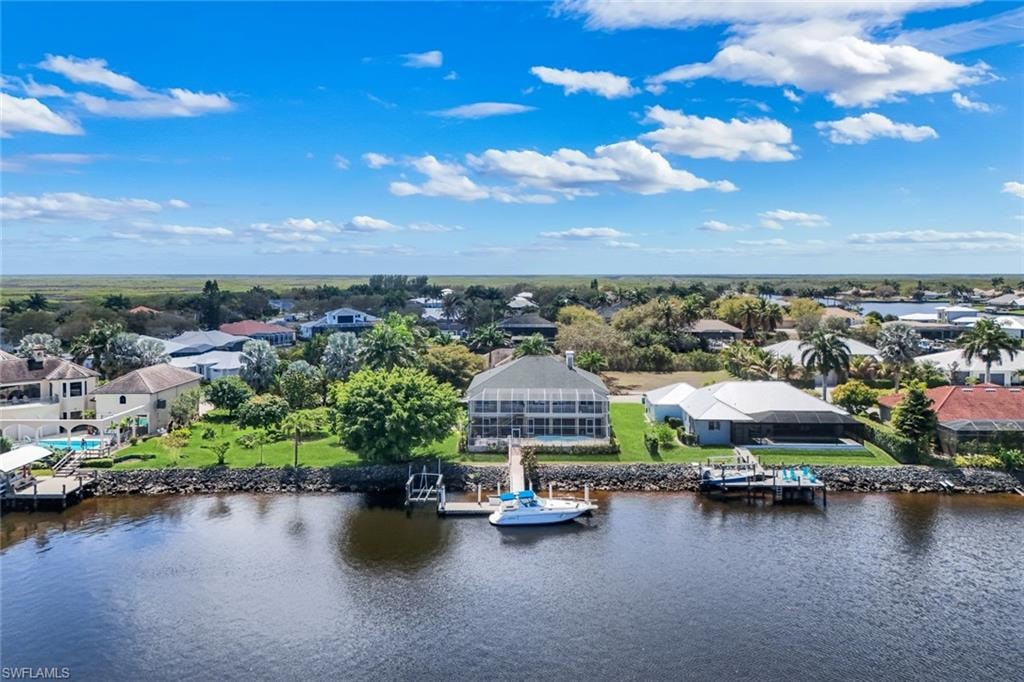 Aerial view of residential area with a large body of water