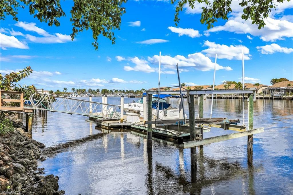 Dock featuring a water view and boat lift