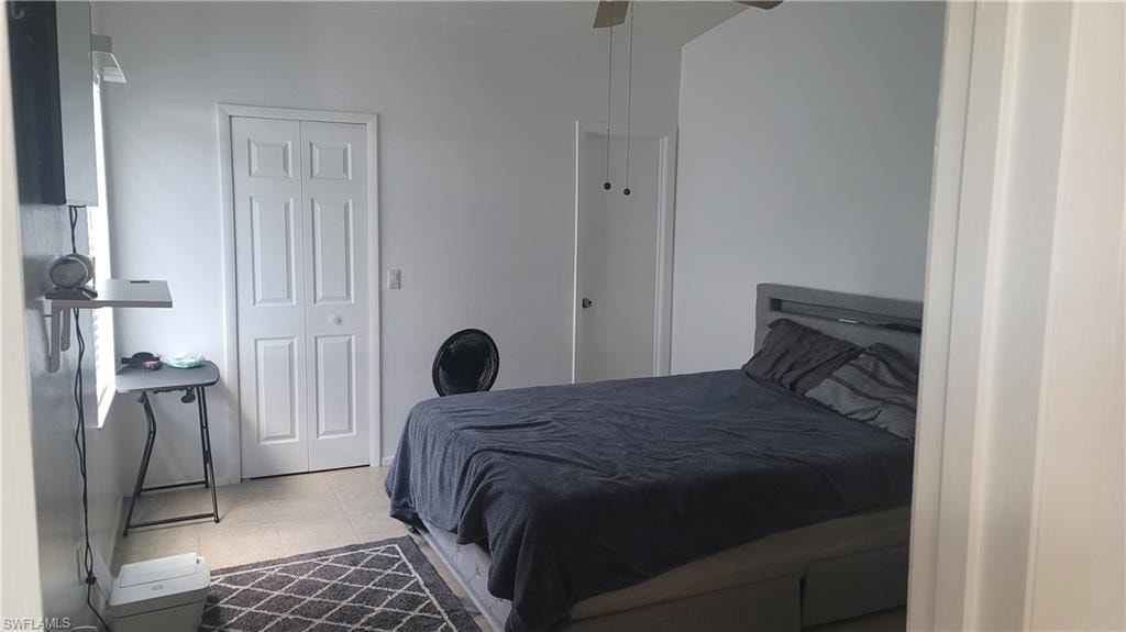 Bedroom featuring ceiling fan and light tile patterned floors