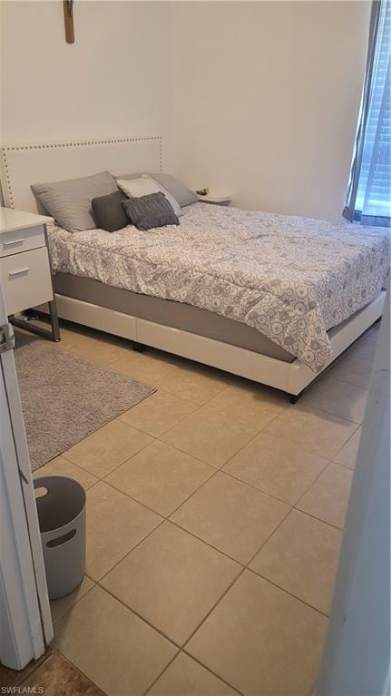 Bedroom featuring light tile patterned floors