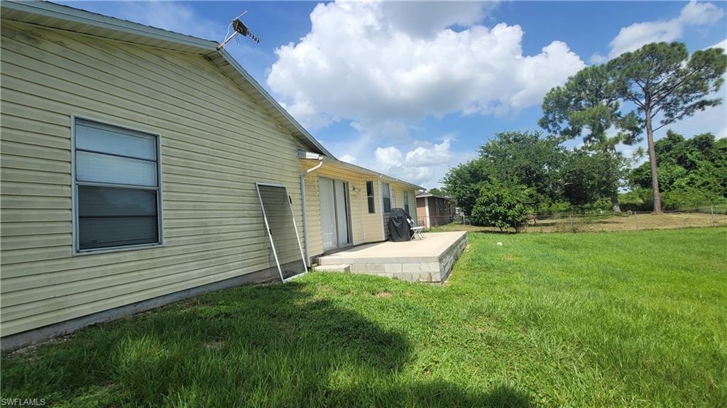 View of yard with a patio