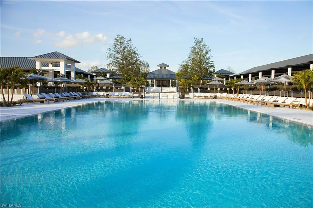 Community pool with a patio