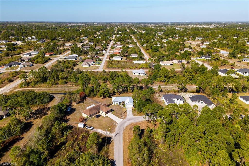 Aerial overview of property's location with nearby suburban area