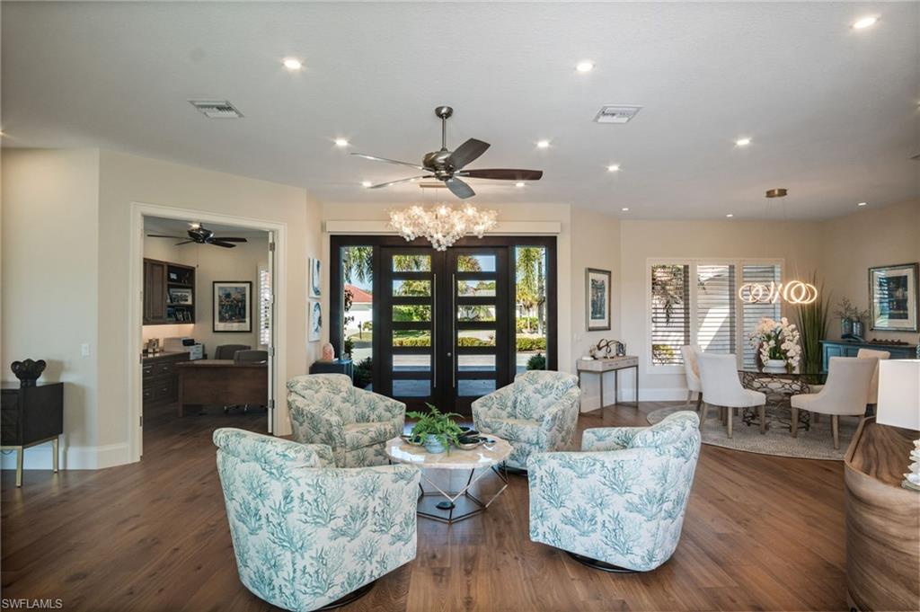 EXPANSIVE and inviting floor plan with HIGH-END HARDWOOD and tile flooring throughout