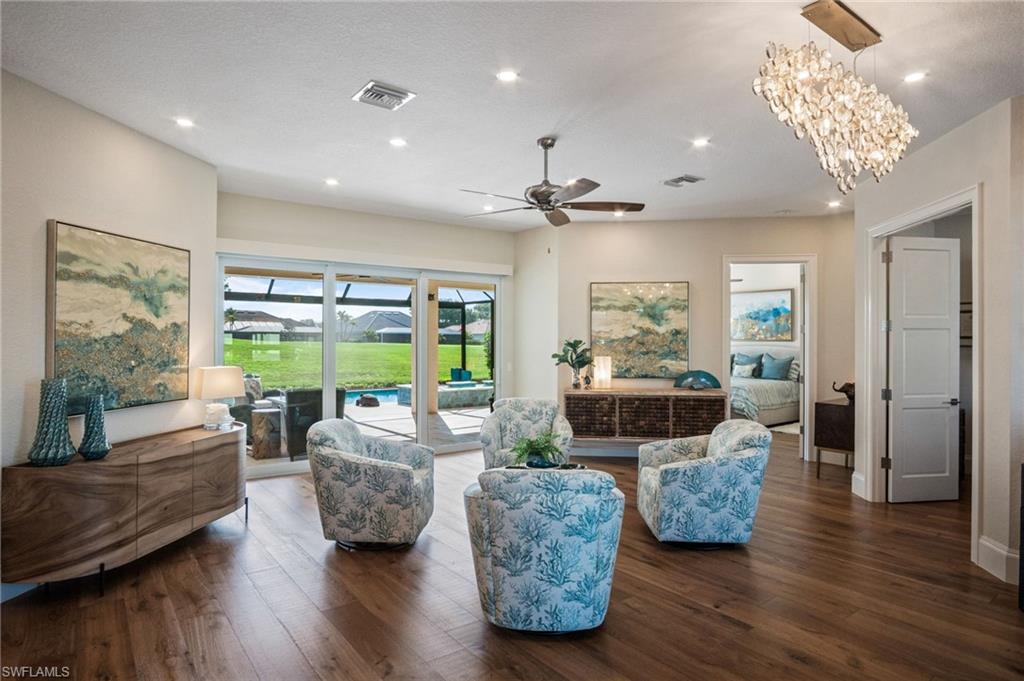 Equipped with electric shades and plantation shutters, whole-house reverse osmosis and soft water systems, LG pedestal washer & dryer with storage drawers, SOLAR PANELS on three sides of the roof, and an extra-wide impact-resistant garage door with decorative sidelights.