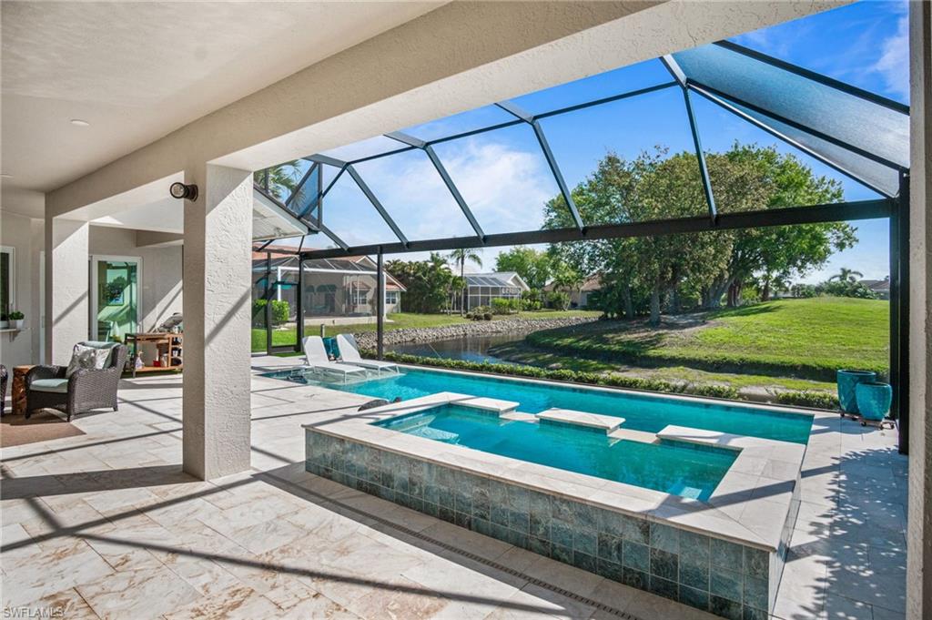 Unwind on the relaxing lanai - marble and spacious covered lounging areas, all enclosed by a picture-screen enclosure that allows for unobstructed panoramic lake & golf course views.