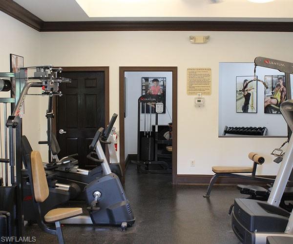 Workout room featuring ornamental molding