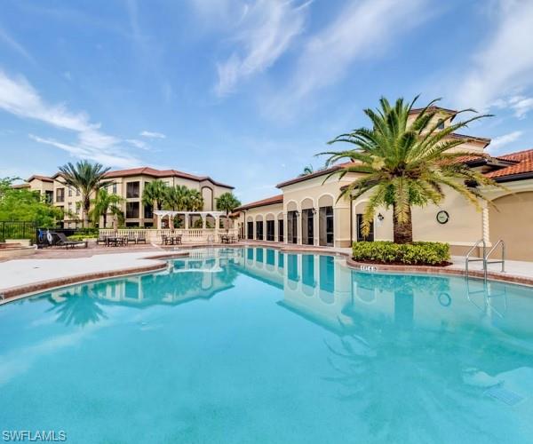 Community pool featuring a patio