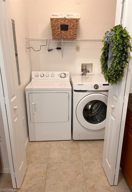 Laundry area with washing machine and dryer and electric panel