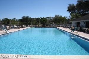Community pool with a patio area