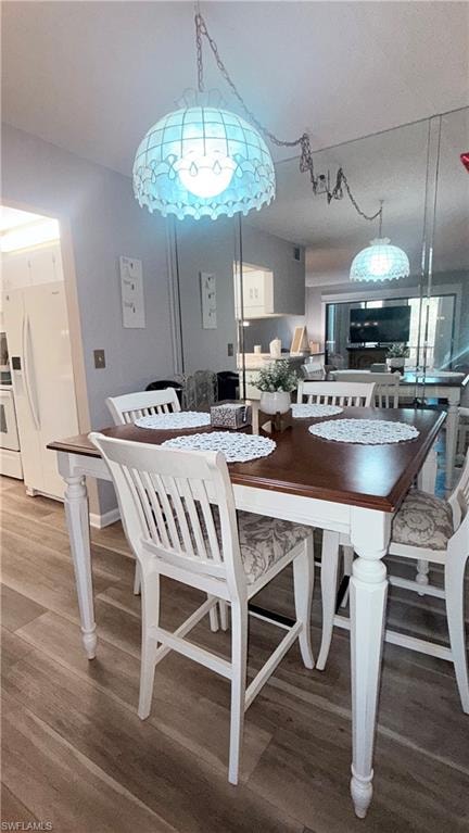 Dining space with wood finished floors