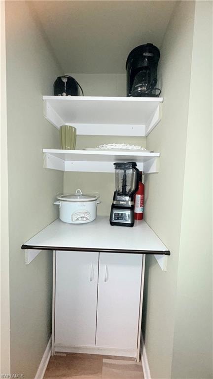 Detailed view of baseboards and wood finished floors