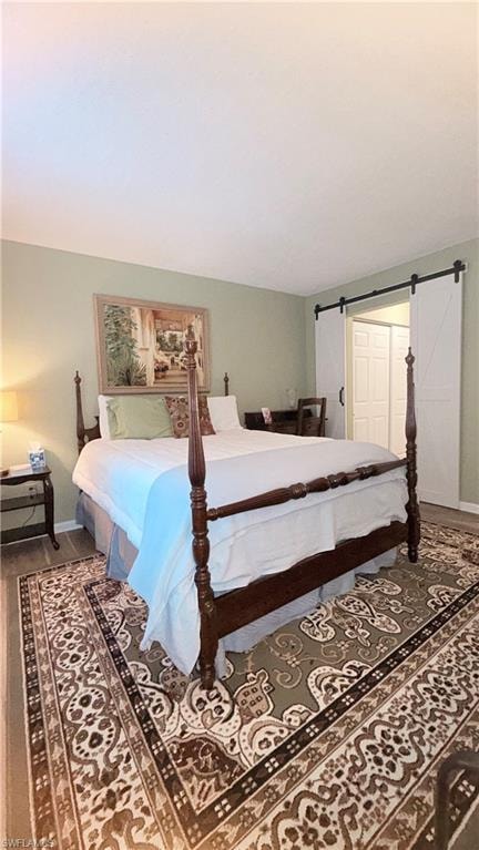 Bedroom featuring baseboards and wood finished floors