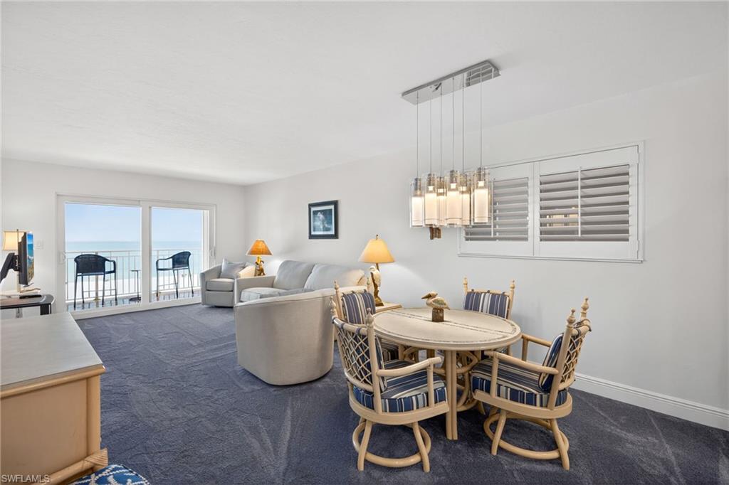 Dining room with dark carpet