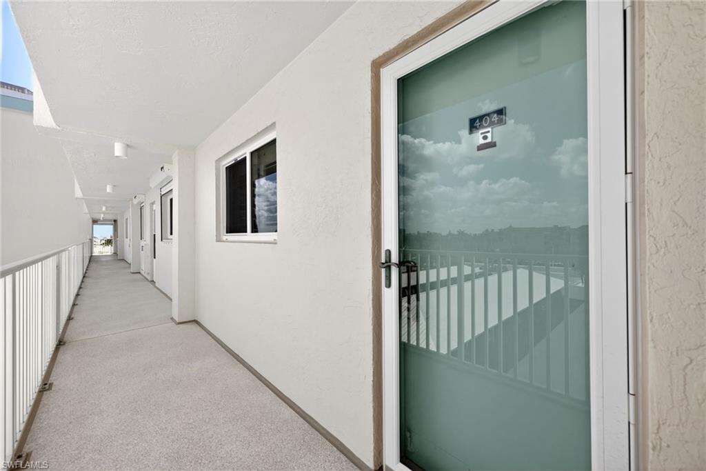 Entrance to property featuring stucco siding