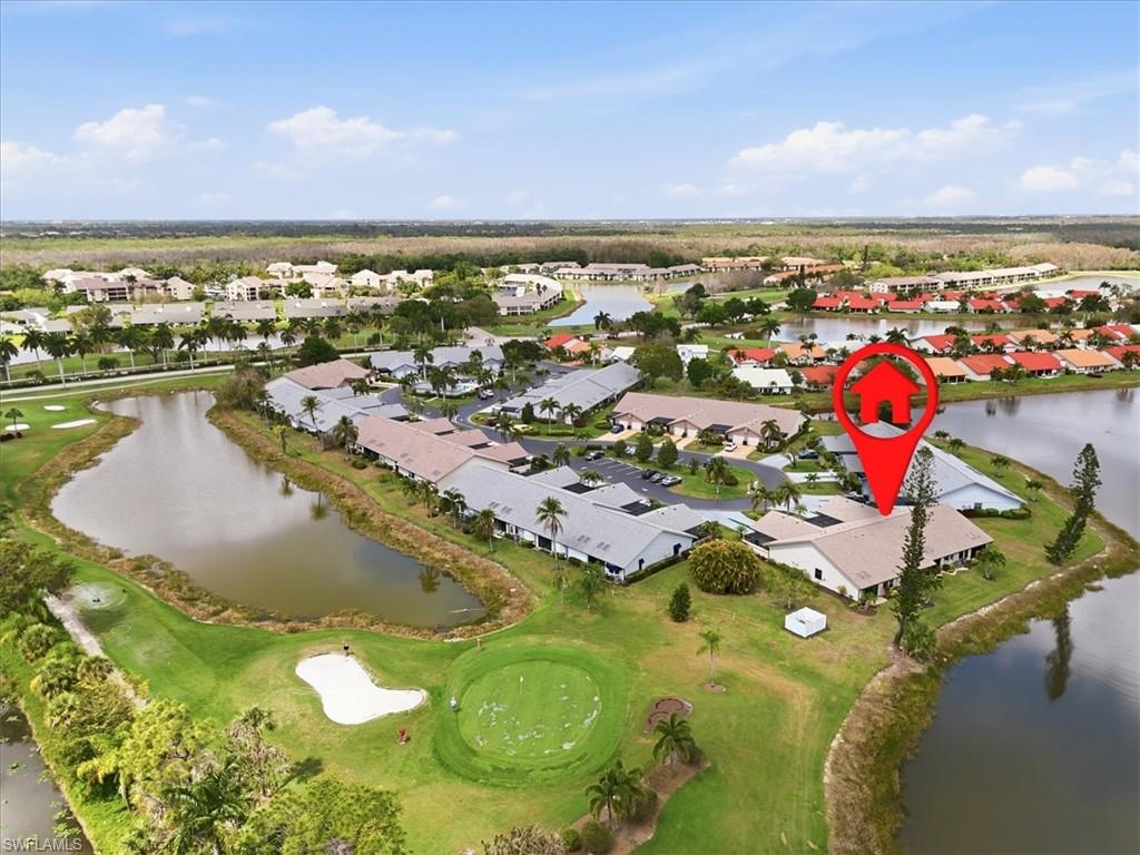 Aerial view of residential area with a nearby body of water