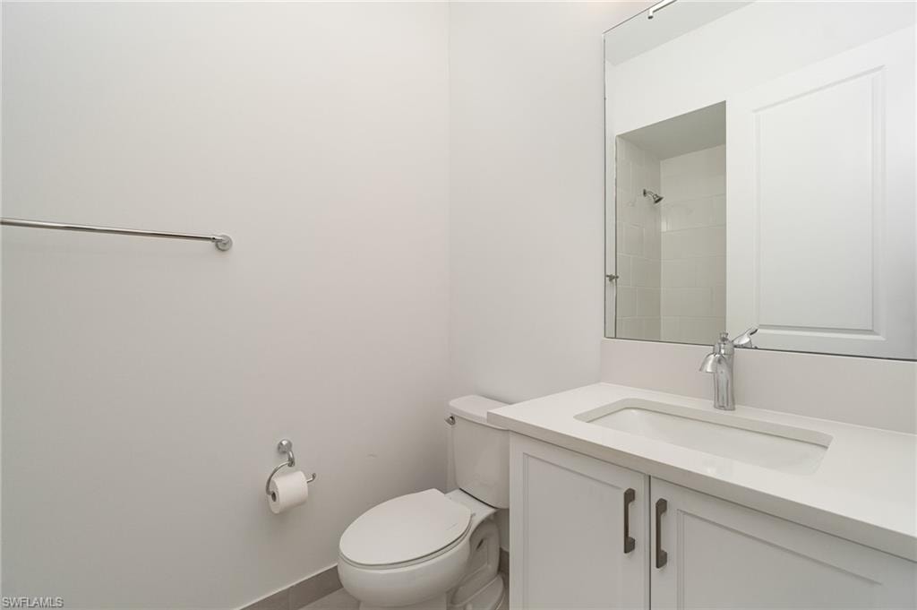 Bathroom with vanity and a shower