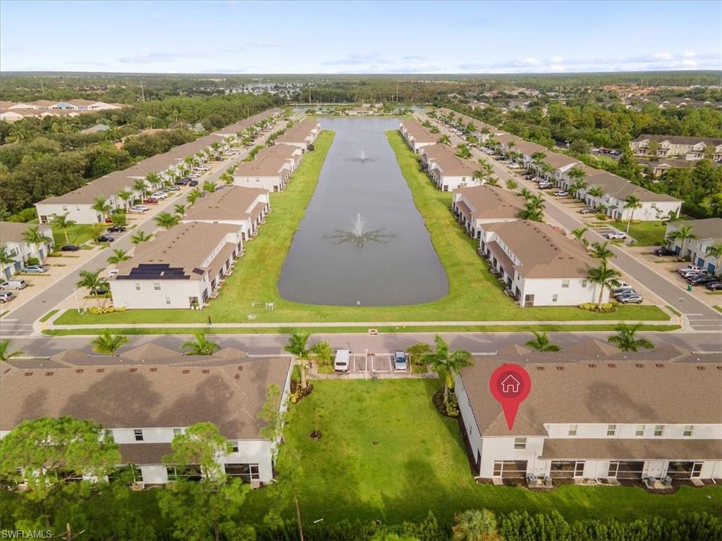 Aerial perspective of suburban area with a large body of water