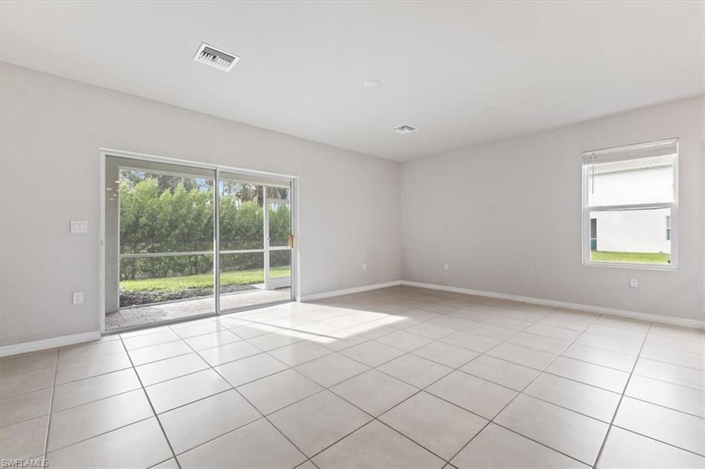 Unfurnished room featuring light tile patterned flooring