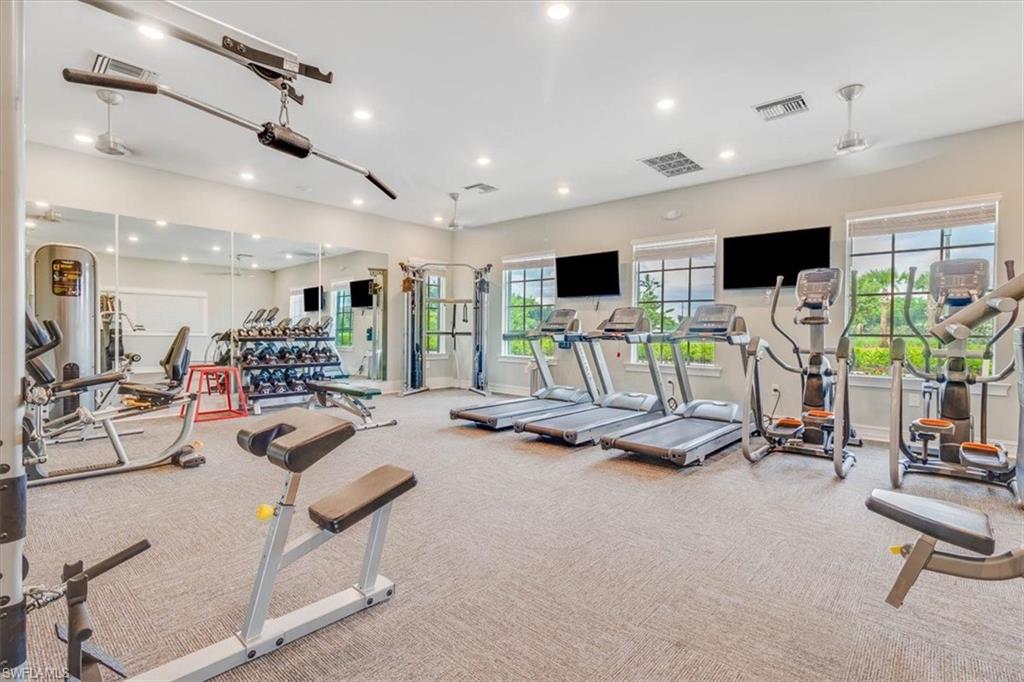 Exercise room featuring recessed lighting
