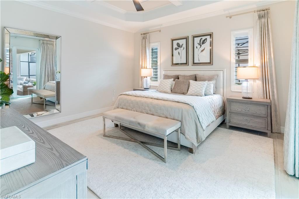 Bedroom with ornamental molding and ceiling fan