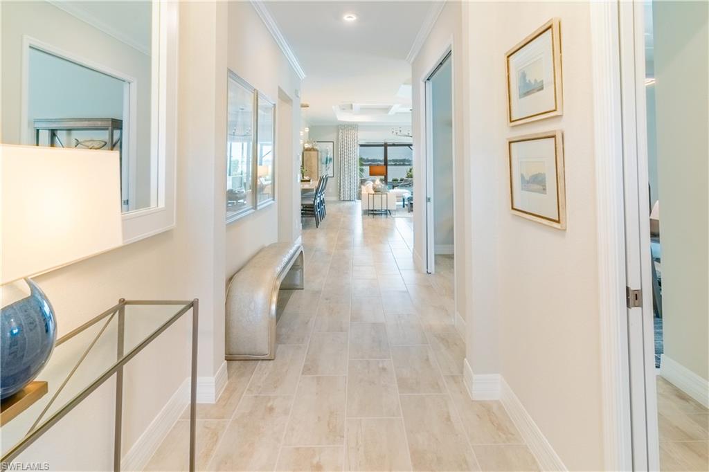 Corridor featuring crown molding