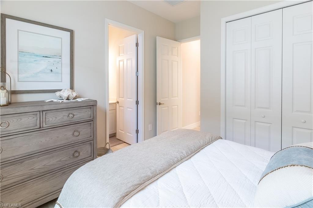 Bedroom with connected bathroom and a closet