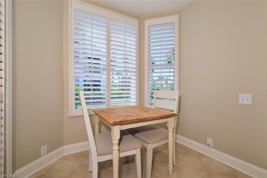 Dining area with baseboards and light tile patterned floors