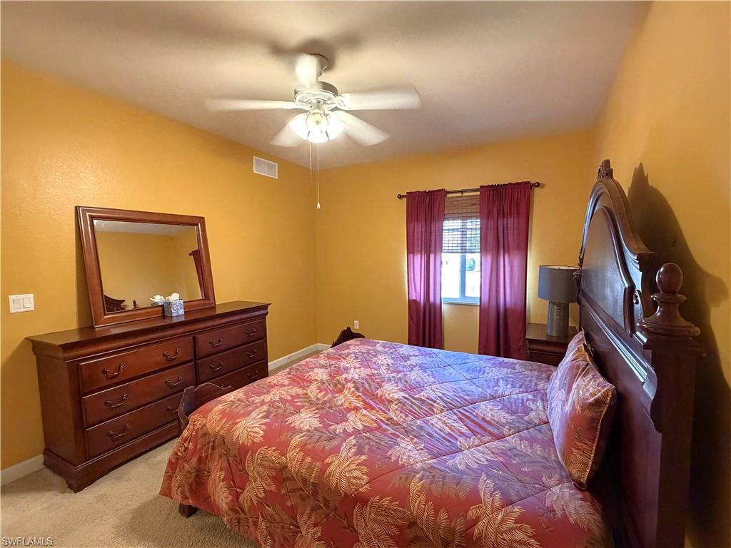 Furnished bedroom with window overlooking the lake