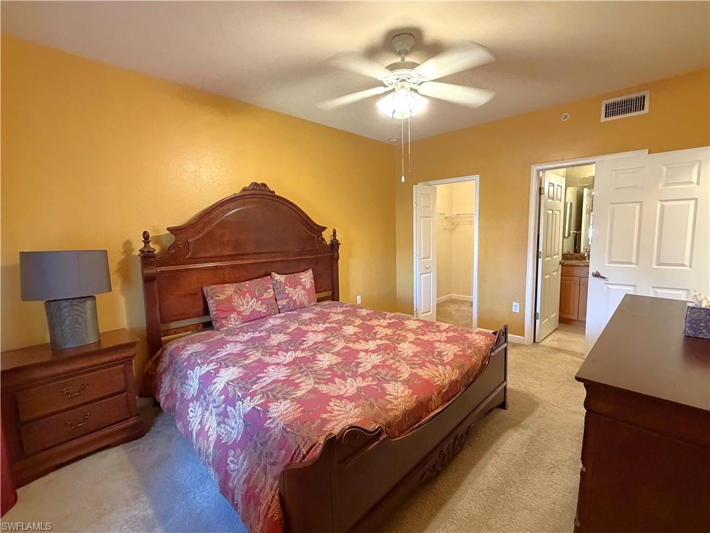 King bed, dresser, night stand, and 2nd entrance to bathroom