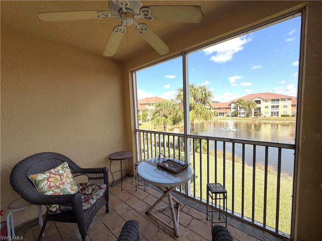 Screened lanai with a view of the fountain and large lake