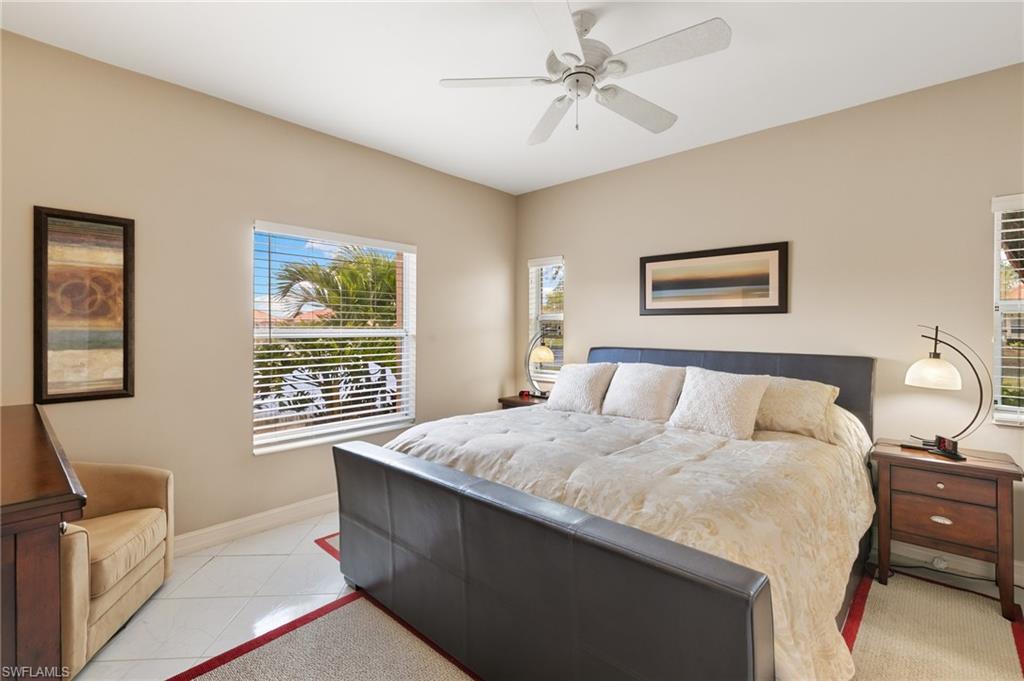 Bedroom featuring a ceiling fan and baseboards