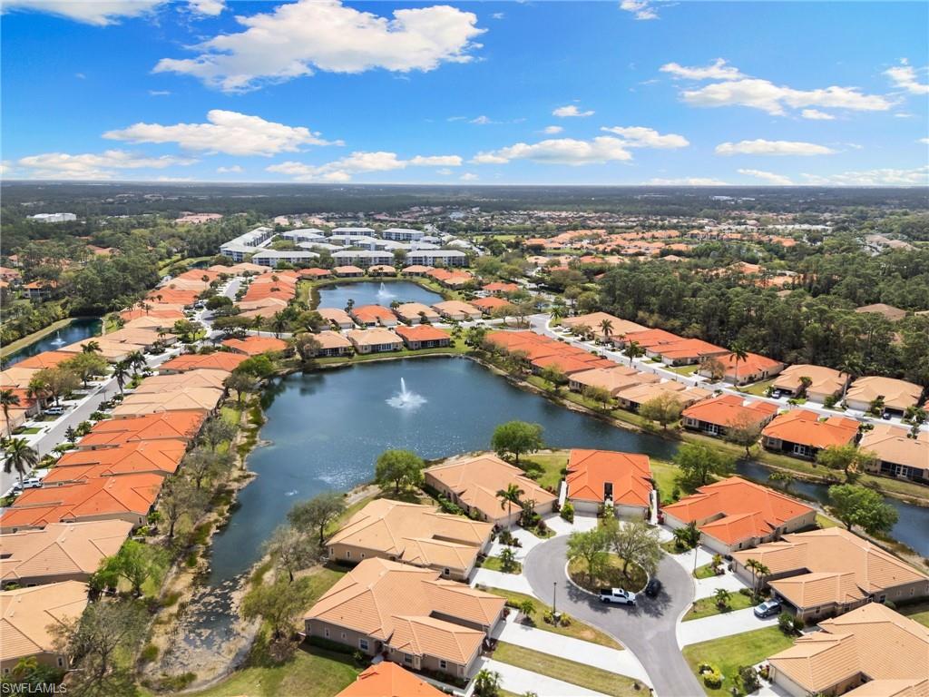 Aerial perspective of suburban area with a nearby body of water