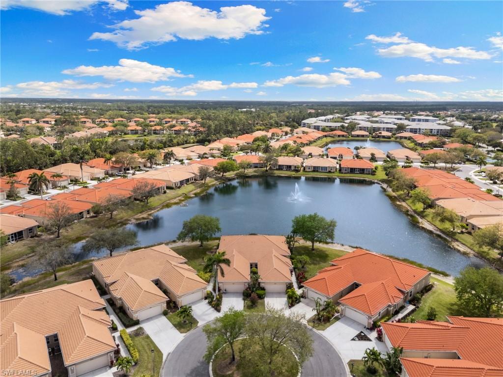 Aerial view of residential area featuring a large body of water
