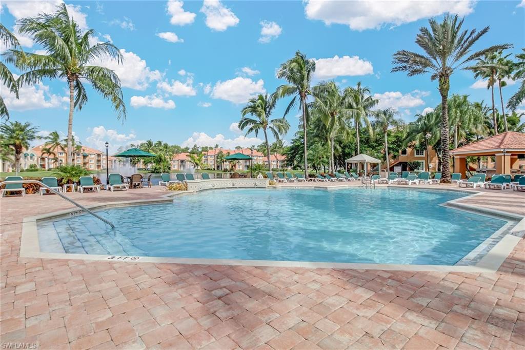 Community pool with a patio area and a gazebo