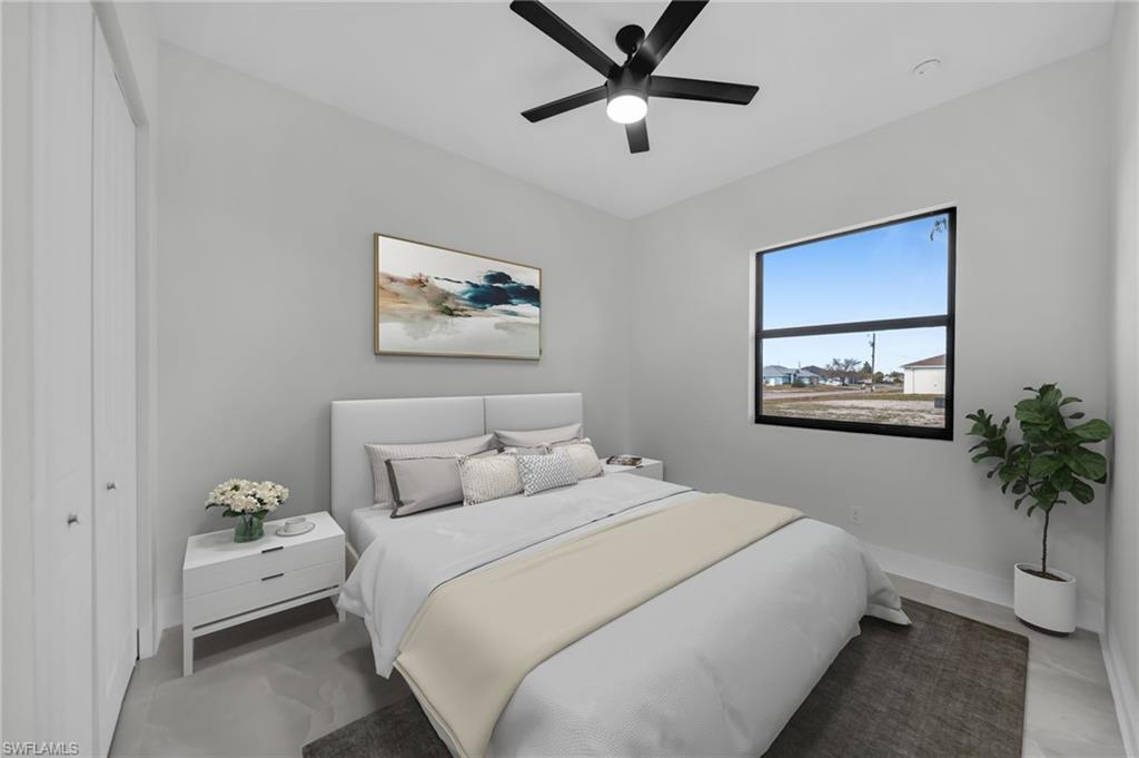 Bedroom featuring a closet and a ceiling fan