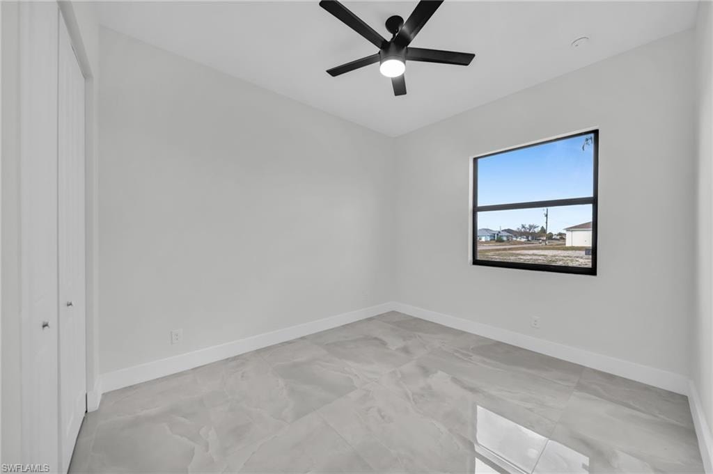 Unfurnished bedroom with a closet and ceiling fan