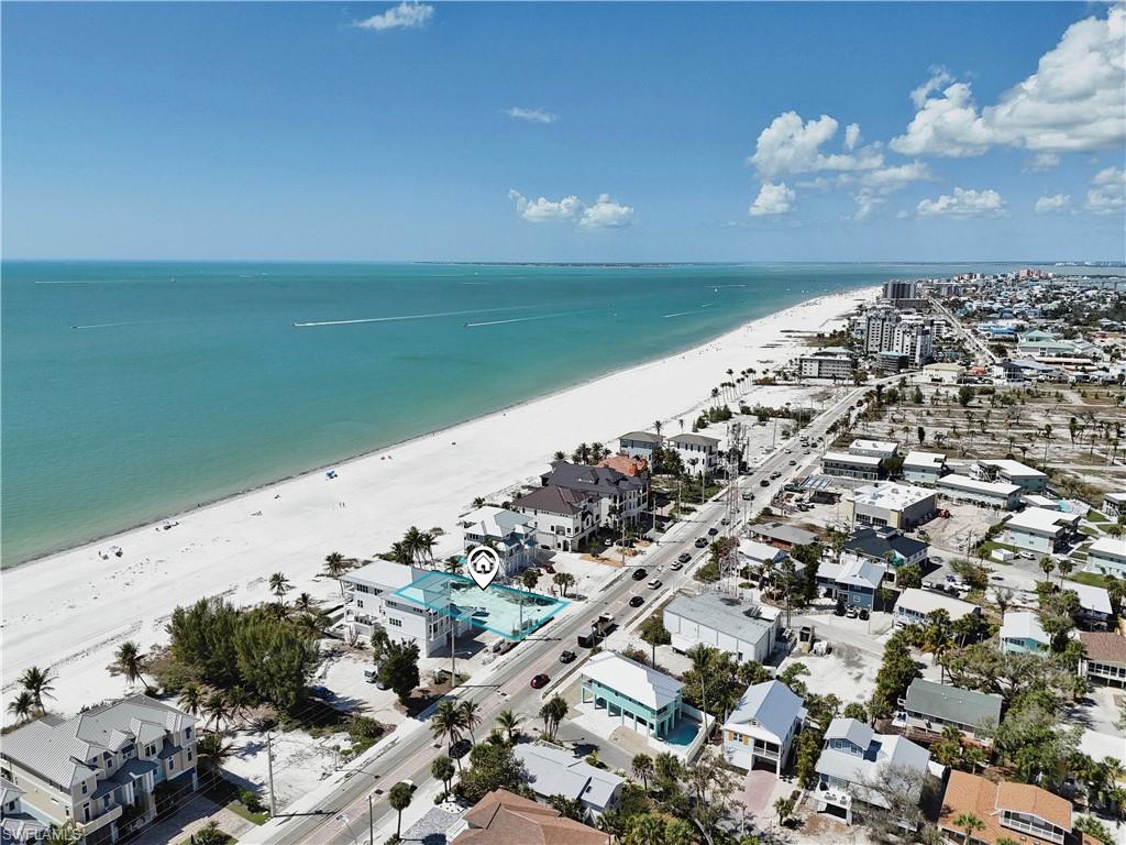 Aerial perspective of suburban area with expansive coastline