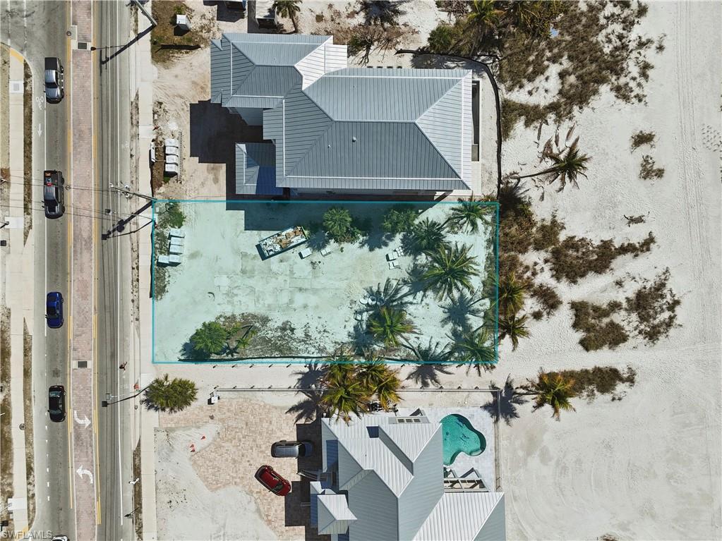 View of subject property with a pool area