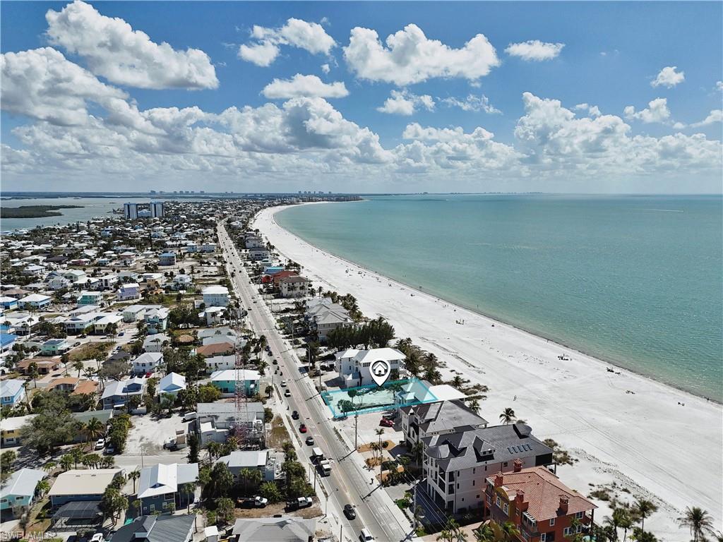 Aerial view of residential area with expansive beach