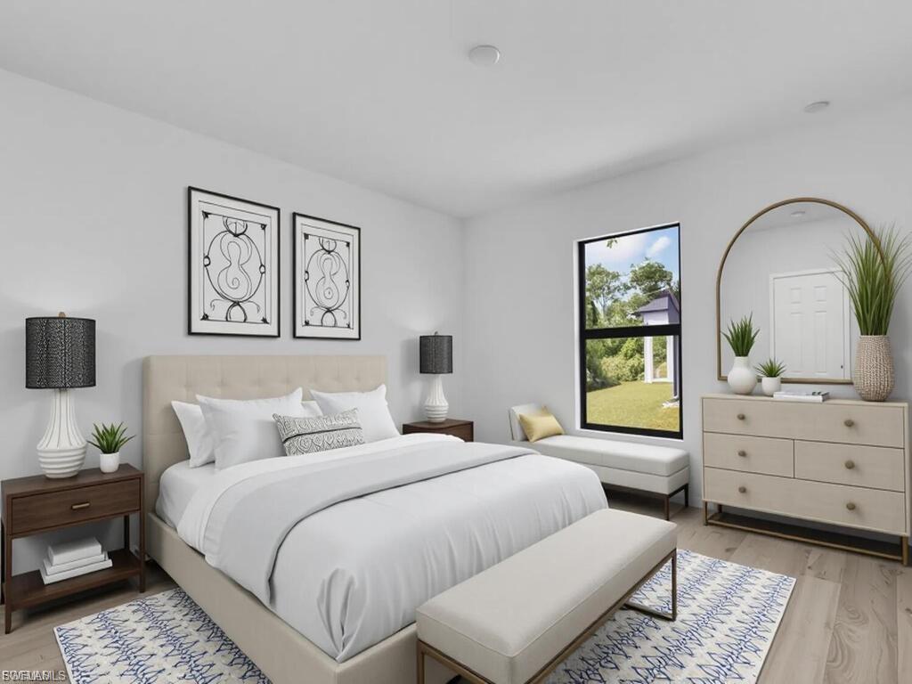Bedroom with light wood finished floors
