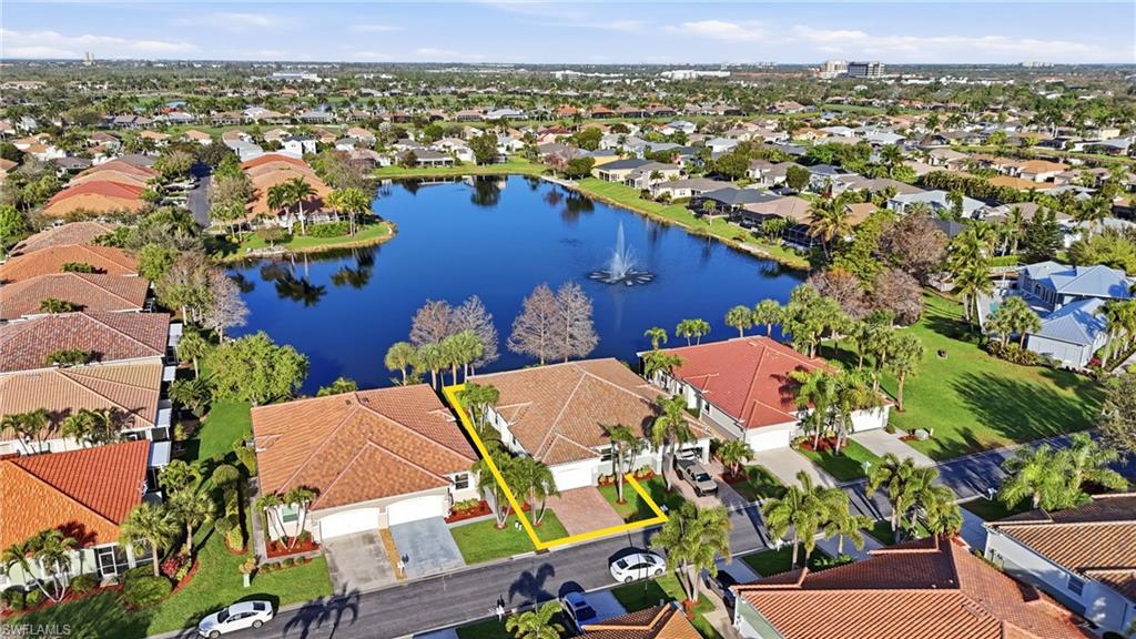 Aerial perspective of suburban area with a large body of water - Virtually Edited Image