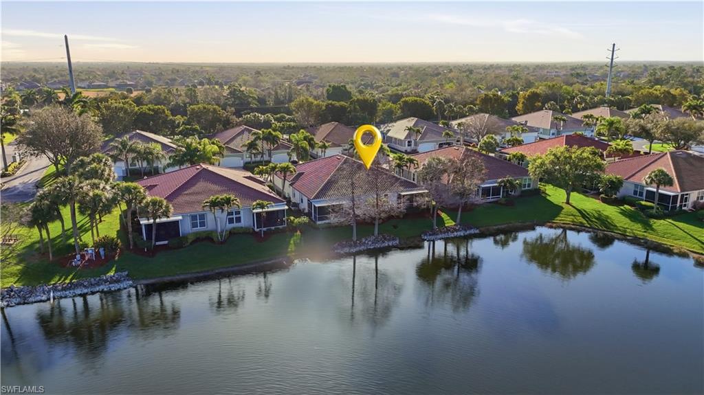 Aerial perspective of suburban area featuring a large body of water - Virtually Edited Image